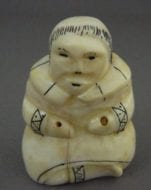 Vintage ivory figure with scrimshaw